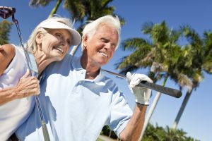 Elderly couple playing golf on Costa del Sol