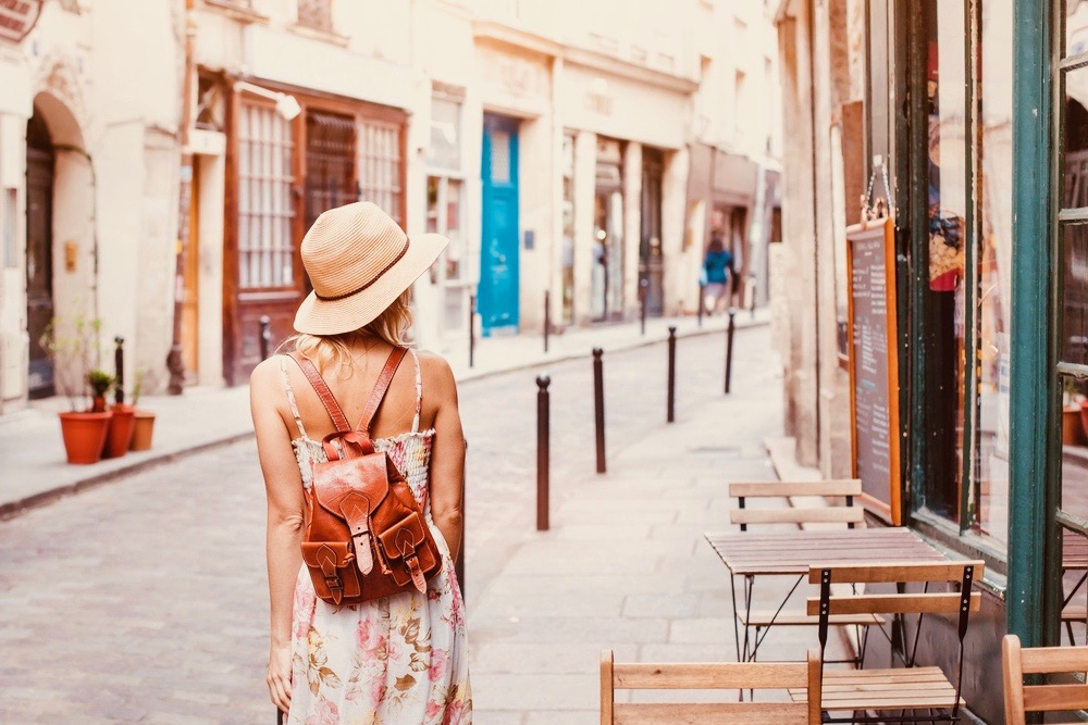 girl walking in a small town